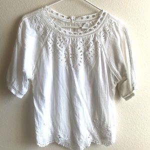 White delicate eyelet lace cutout shirt.